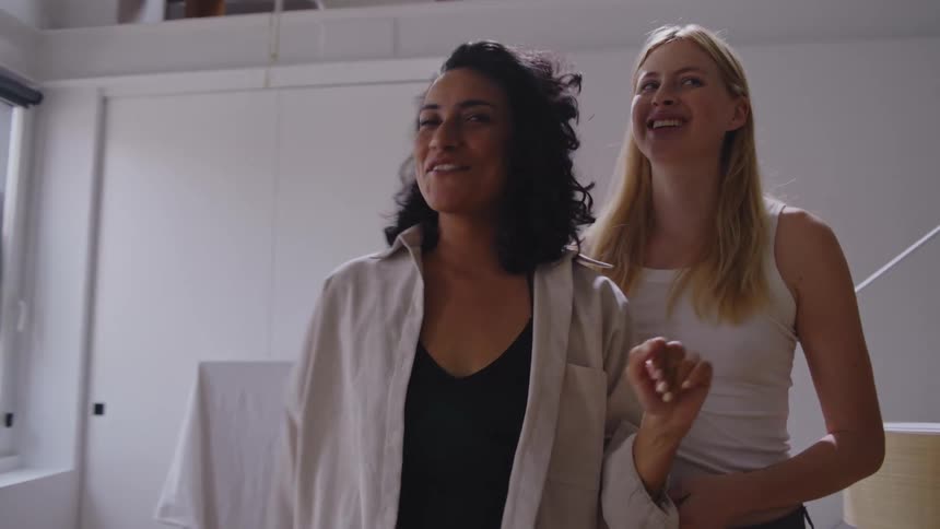 Two women talk and hug