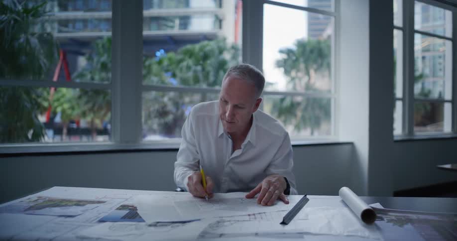 A clip of a man focused on work in the office