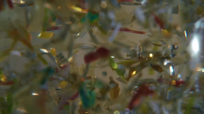 Shards of colored glass floating in a kaleidoscope