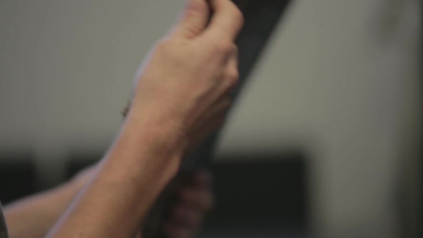 A person pulls a record from a shelf