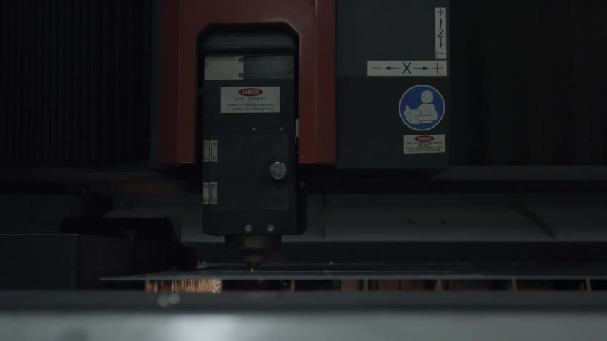 Machine saws metal and creates sparks