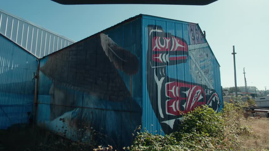 Blue metallic wall with graffiti
