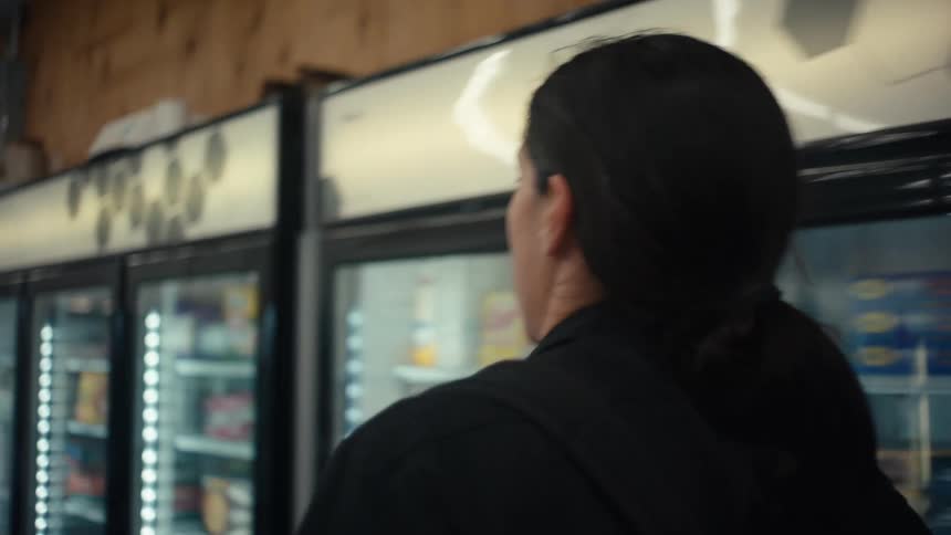 Man walking inside a convenience store