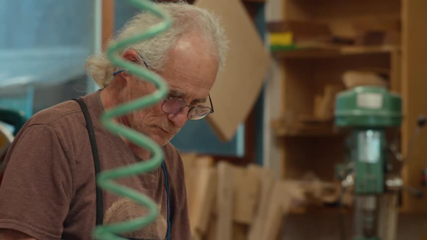 Carpenter preparing materials for application to wood
