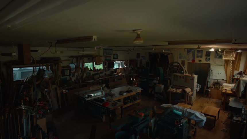 The workshop is dark and empty