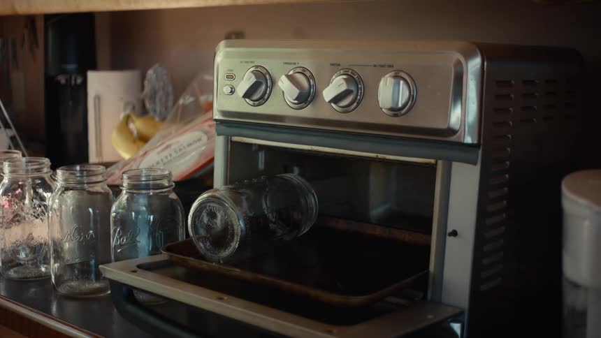 A clip of a person sterilizing jars