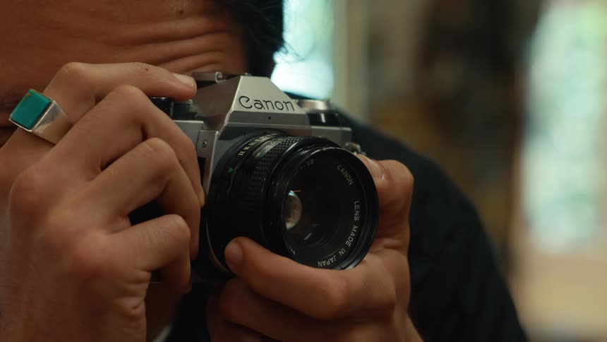 Man handling a professional camera