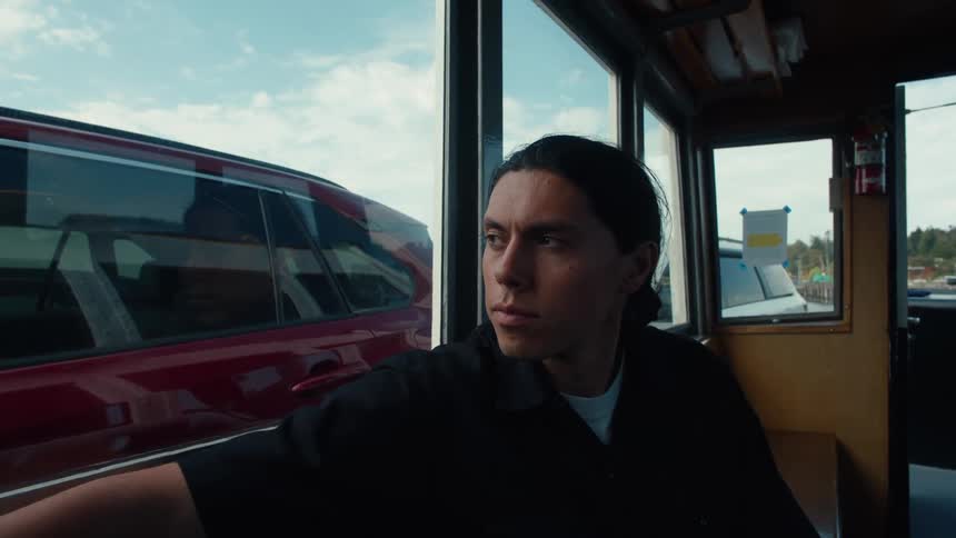 Man sitting inside a moving transport