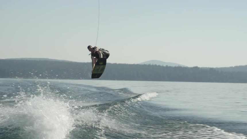 A water skier performs a jump