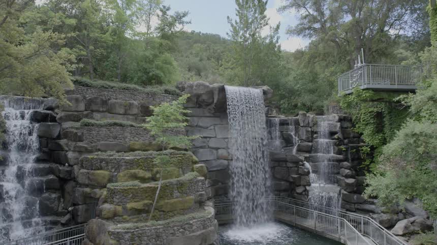 Water falls down a stone waterfall
