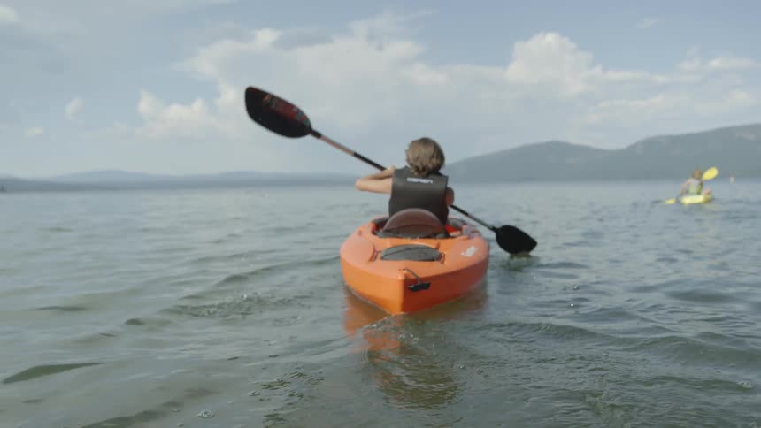A person is rowing in a canoe