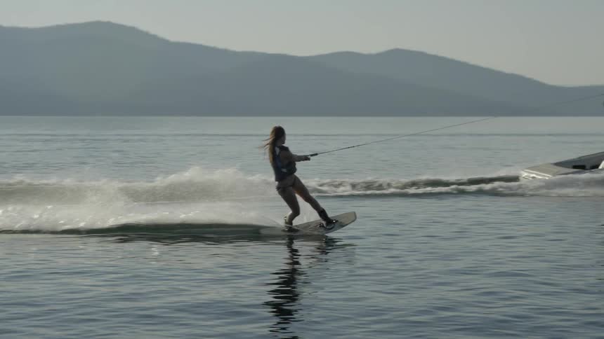 Person water skiing on a sunny day