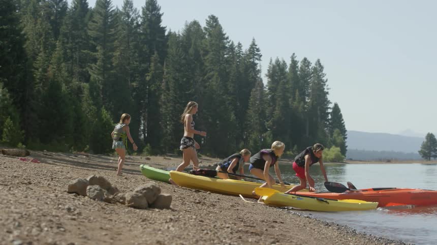 People run downhill towards the water