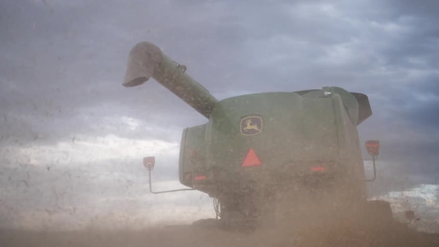 Combine harvester operating in a field