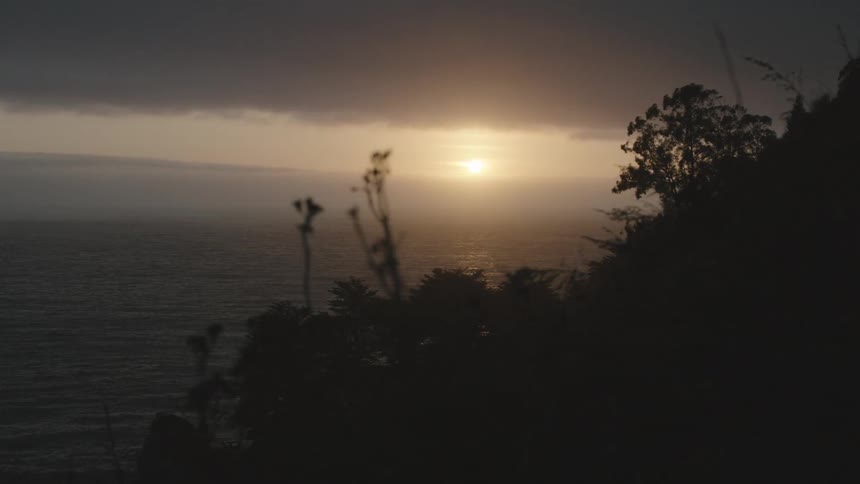 The sun sets over the ocean