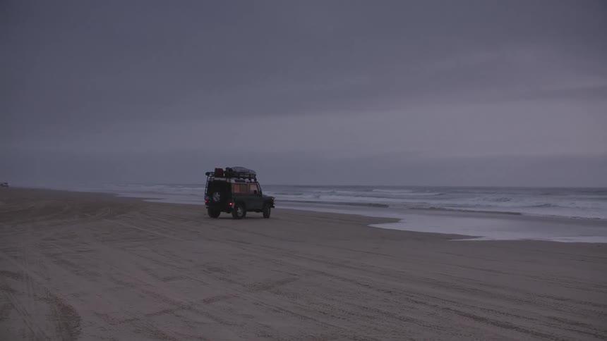Jeep pulls a u turn on the beach