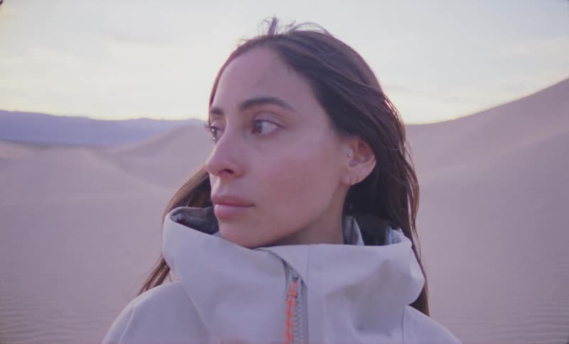 Portrait of a woman in the desert in a beige jacket