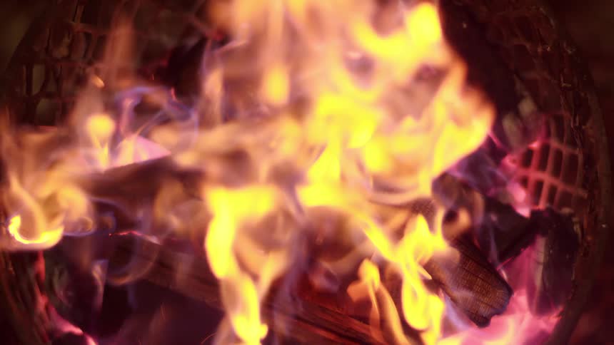 A campfire is burning at night