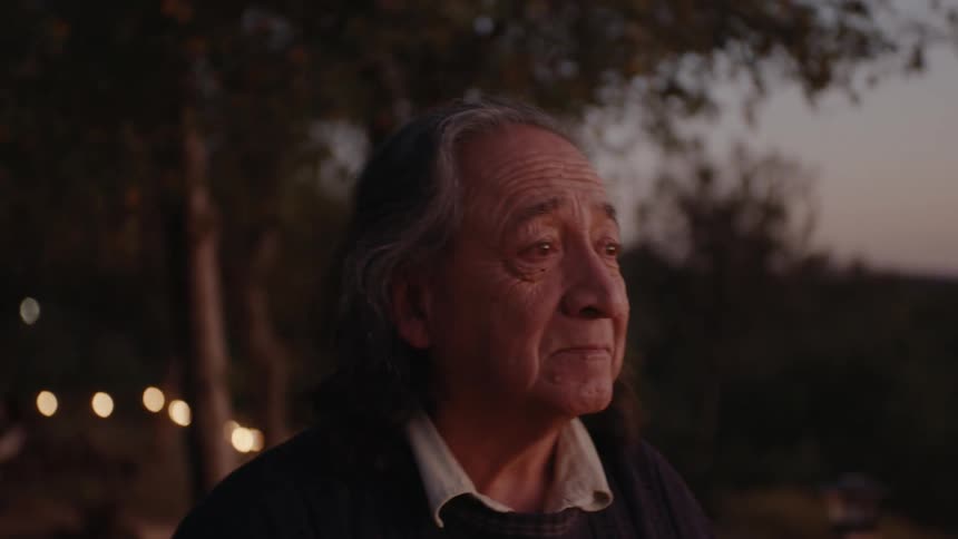 Portrait of an elderly native man walking through a natural area in the late afternoon