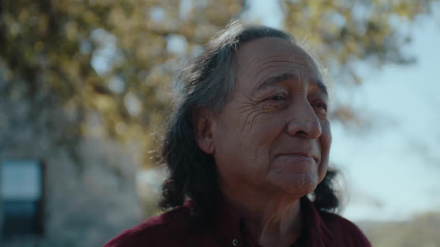 Portrait of a very happy elderly man in an outdoor area