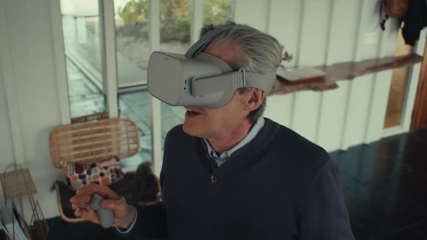 Man having fun with virtual reality glasses