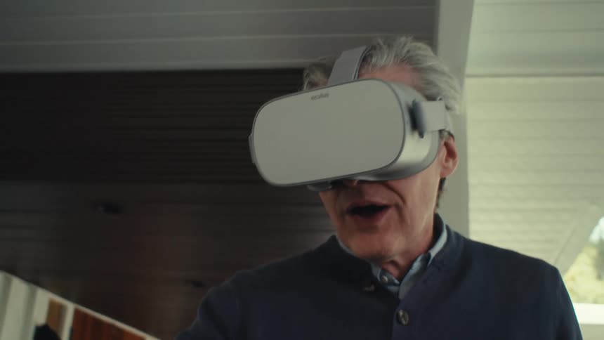 Man having fun with virtual reality glasses