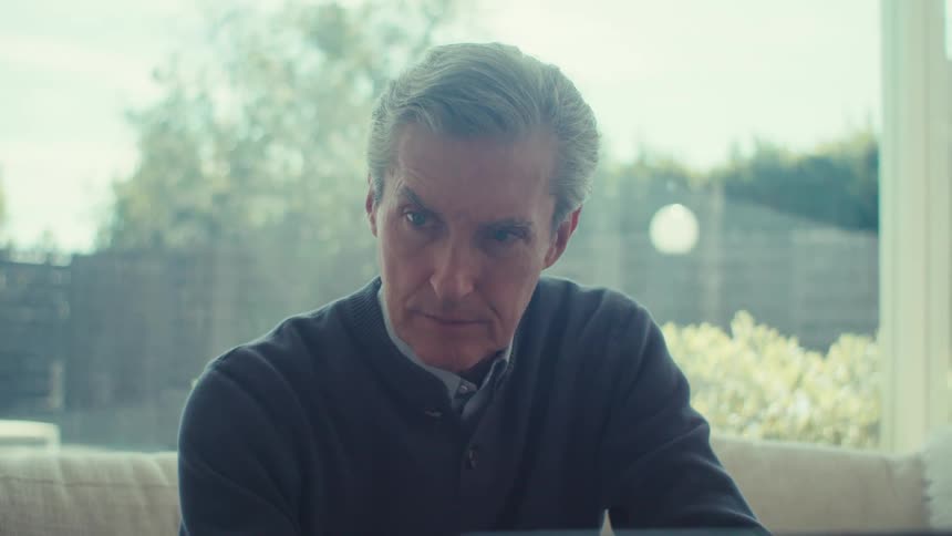 Man sitting in front of a laptop
