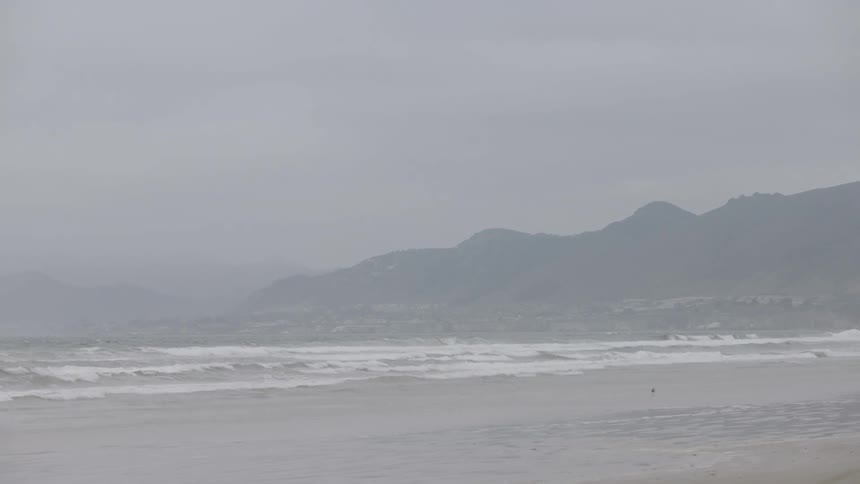 Waves crash onto the beach