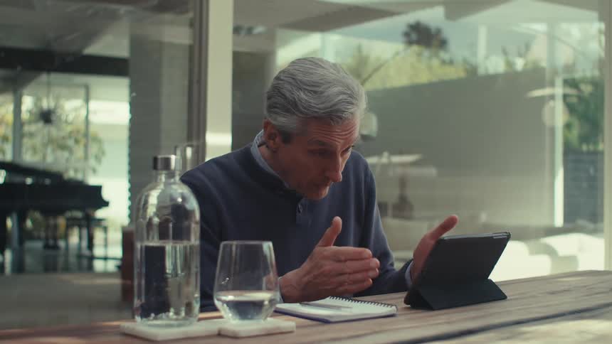 A person having a conversation on a tablet