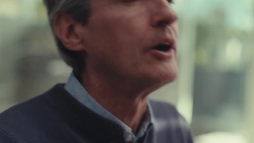 Portrait of a grayhaired man talking