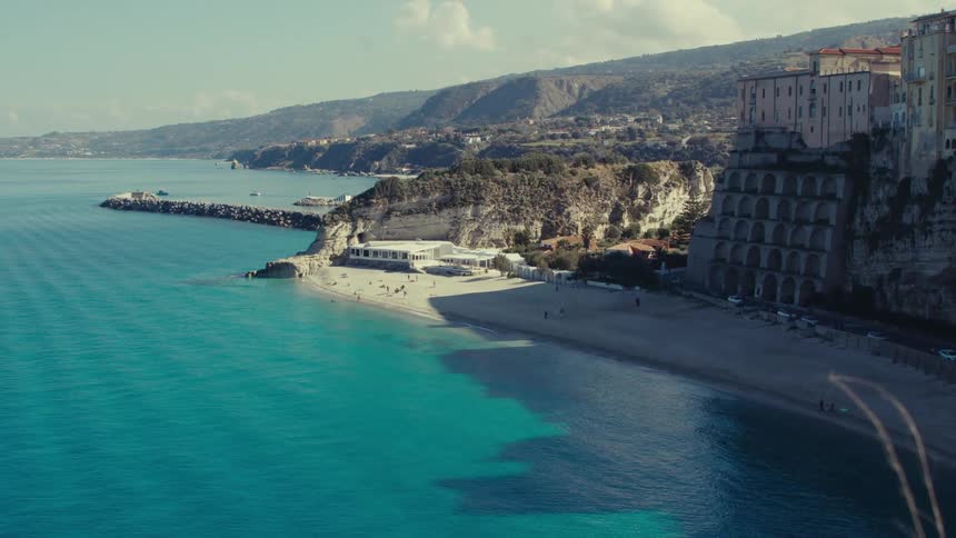 Homes are build near the beach on a cliff
