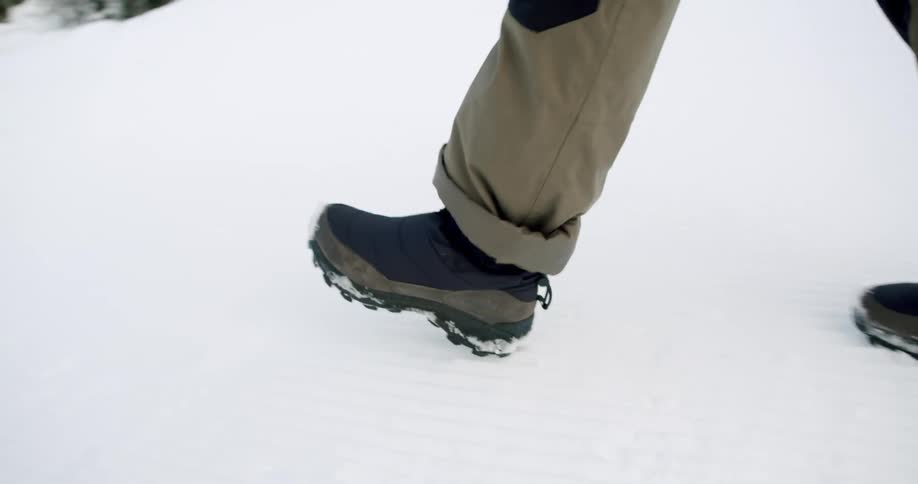 A person is hiking on the snow