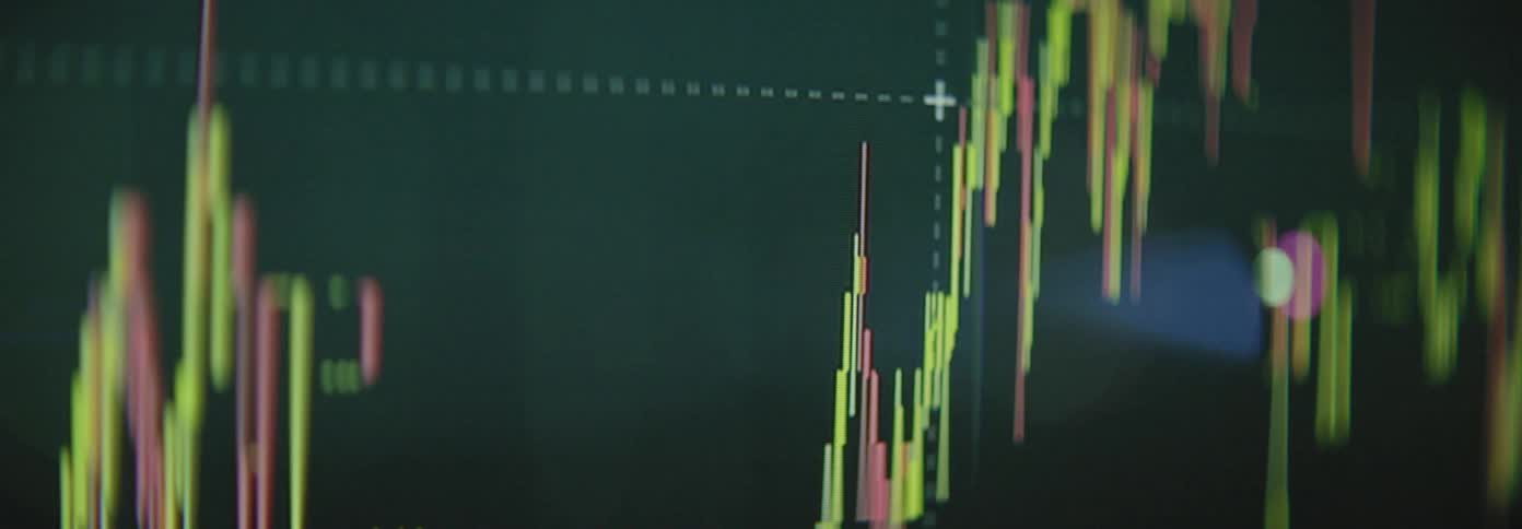 A financial trading graph with colorful lines displaying market trends