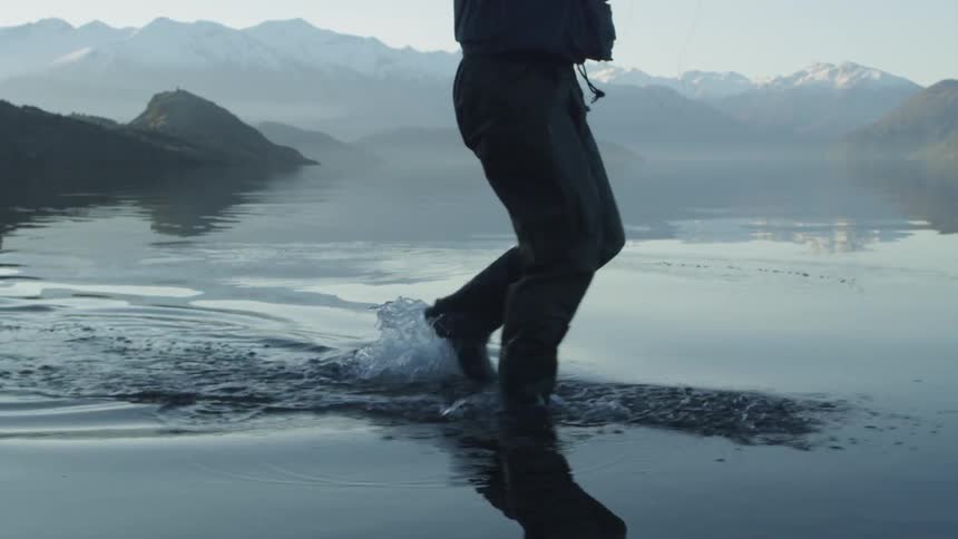 A man fishes in a river