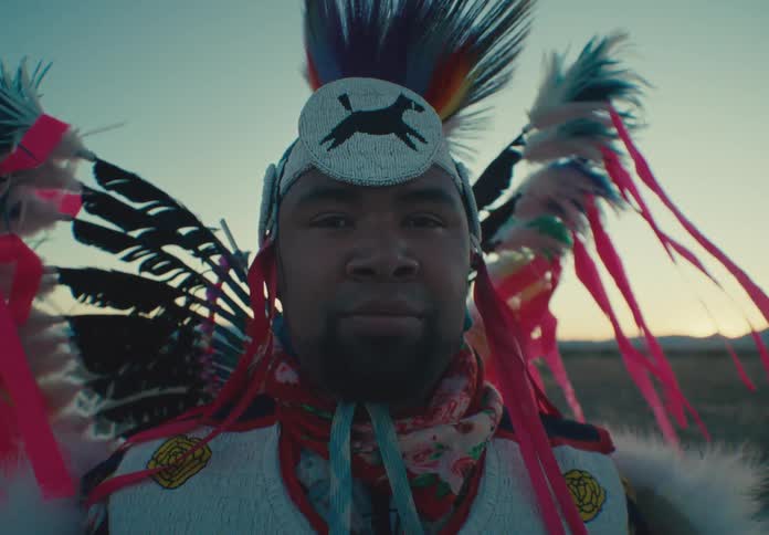 Portrait of a man dressed in native american attire