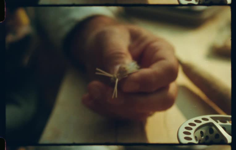 Close up of a pair of hands working with a wire