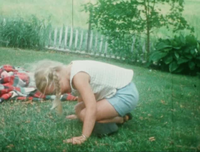 A clip of kids playing on the lawn