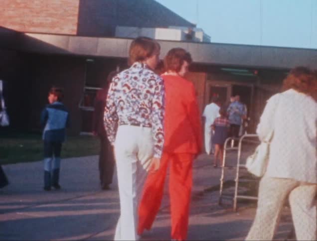A clip of people walking into a building