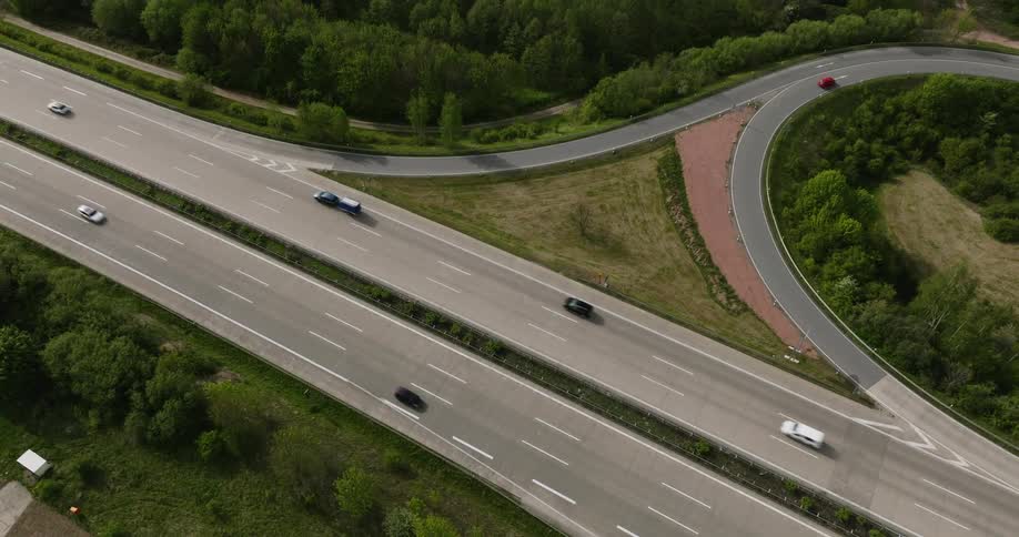 A highway with several cars driving along it