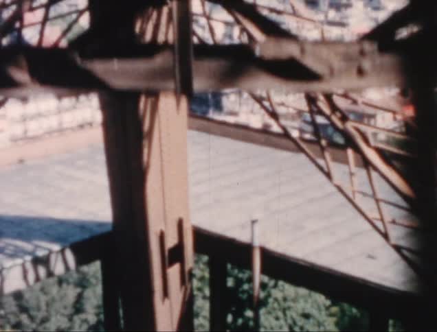 Moving view of a climb up a metal tower