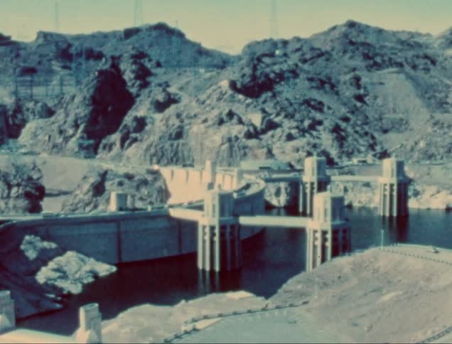 The massive hoover dam reservoir stretches across a deep canyon