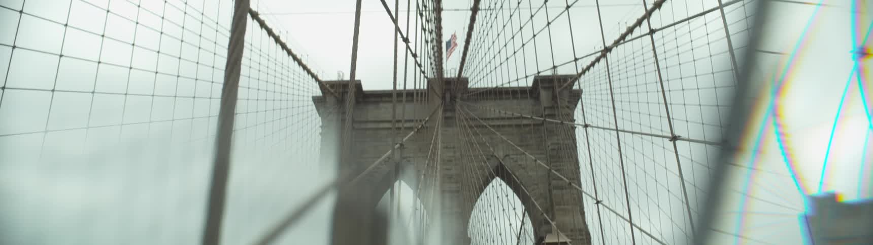 A bridge has many wires coming from the top