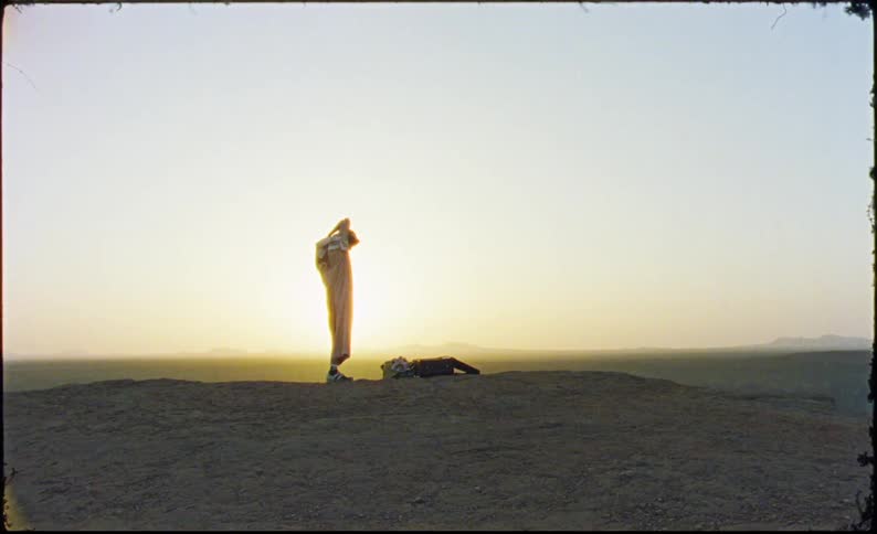 Man in arabic clothes on a mountain