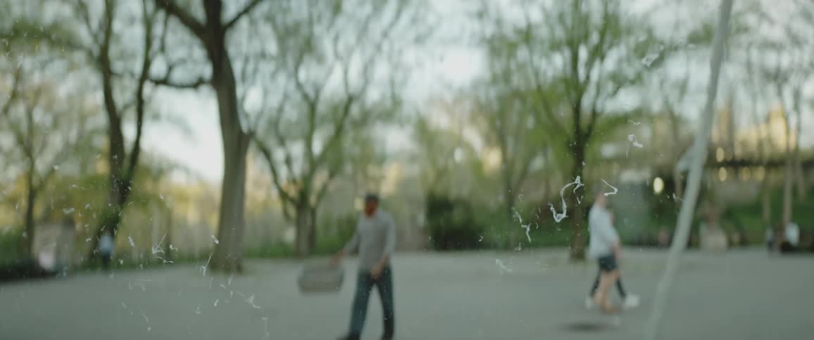 A large bubble is popped in a park