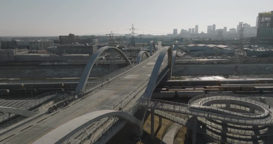 The 6th street viaduct in los angeles a modern bridge with distinctive arches and a winding pedestrian walkway