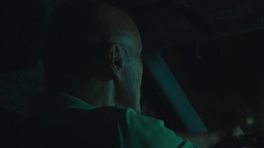 Man driving a car at night