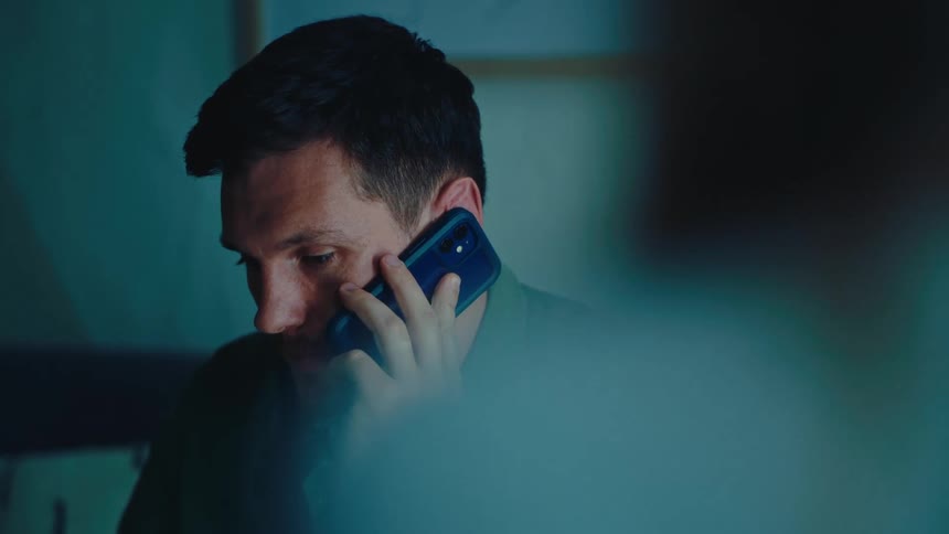 Man sitting talking on cell phone