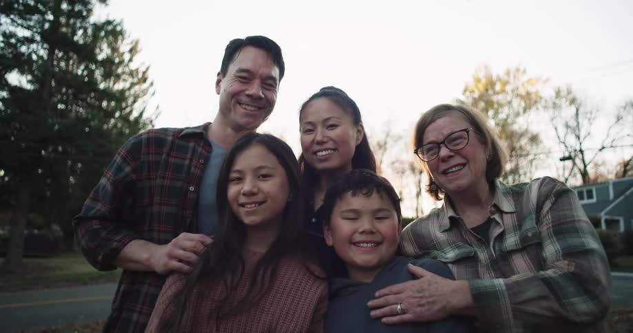 Family posing together outdoors