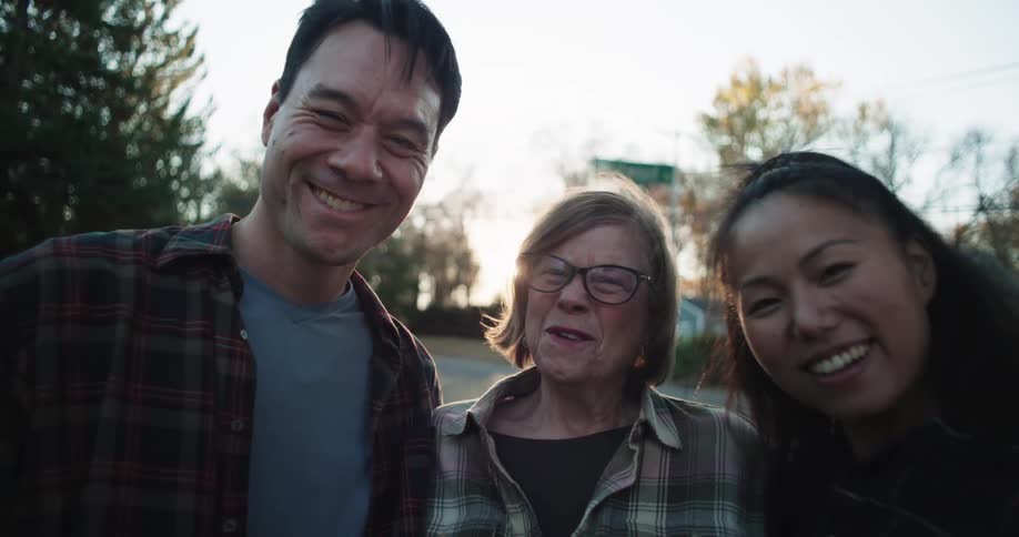 Blonde woman in the middle of a happy couple