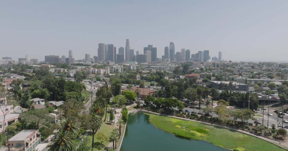 Aerial view of a lake in a city and skyscrapers on the horizon